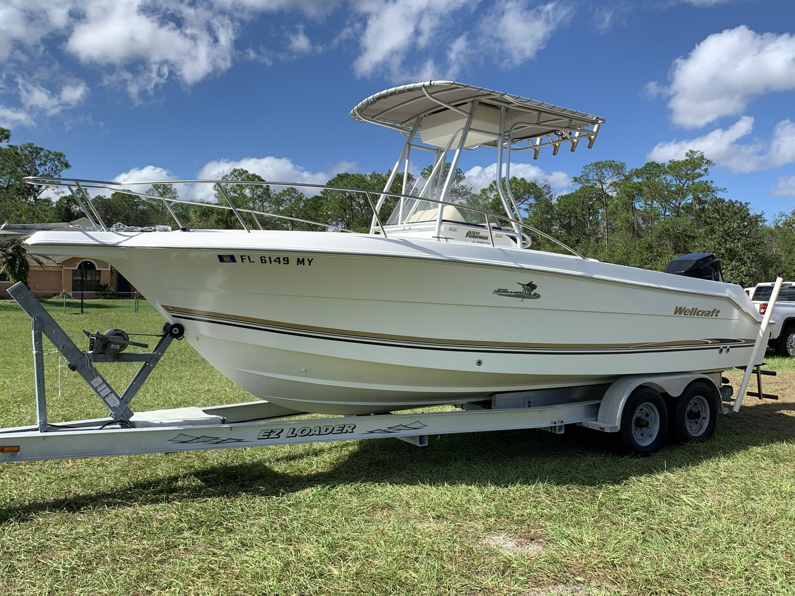 Wellcraft center console fishing boat on a trailer